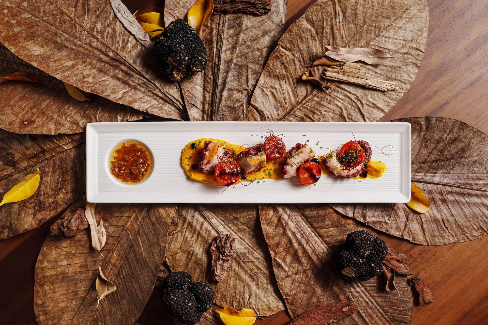 Course of the Autumn Omakase at Nobu Hotel Marbella, served on dried leaves