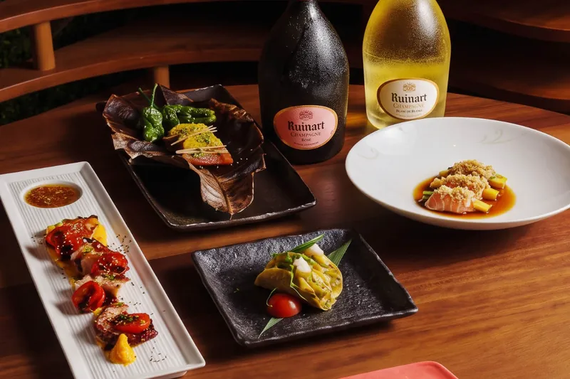 Nobu Hotel Marbella Champagne Week: Ruinart bottles beside courses of the Autumn Omakase